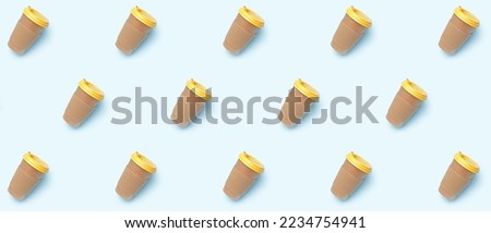 Many paper coffee cups on light background