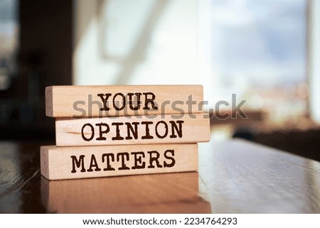 Wooden blocks with words 'Your Opinion Matters'.