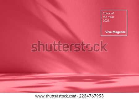 Abstract red studio background for product presentation. Empty room with shadows of window and flowers and palm leaves . 3d room with copy space. Trendy Color of the Year 2023 viva magenta