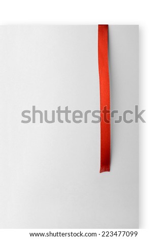 Red ribbon bookmark on empty paper card