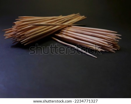 toothpick made of bamboo with black background