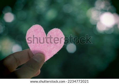 Heart shape on nature background in love concept for Valentine Day, small heart shape representing love