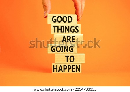 Good things happen symbol. Concept words Good things are going to happen on wooden blocks on a beautiful orange table orange background. Businessman hand. Business good things happen concept. Royalty-Free Stock Photo #2234783355