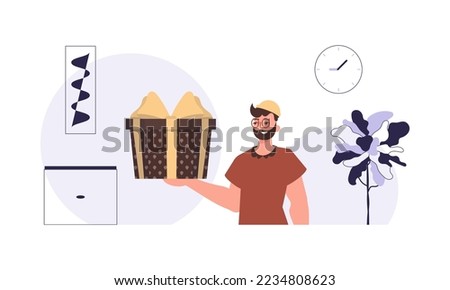 Christmas gift concept. A man holds a festive gift box.