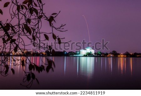 Long exposure of the Antares rocket, seen launch into space above the Thomas Jefferson Memorial. Digitally enhanced. Elements of this image furnished by NASA.