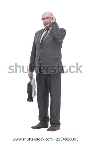 Executive business man with a leather briefcase. Royalty-Free Stock Photo #2234820303