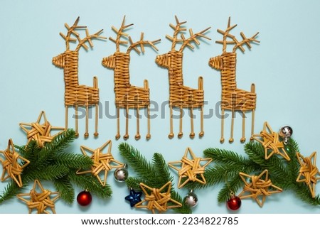 christmas background with branches and vine decorations. New Year's handmade interior toys. DIY holiday toys