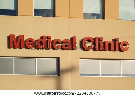 Medical clinic sign on office building exterior