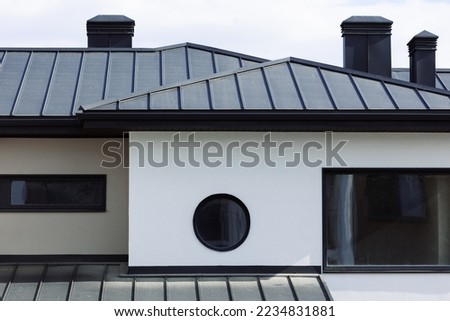 Many modern white cottages with panoramic windows on the background of the park and blue sky. Royalty-Free Stock Photo #2234831881