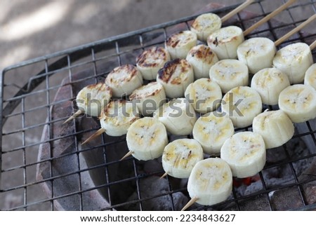 Banana grill, cultivated banana fruit on a hot charcoal grill. Thailand sweet