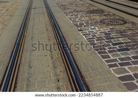 Metallic tracks in urban environment for tram. background image.