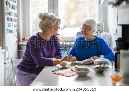 Woman spending time with her elderly mother at home

 Royalty-Free Stock Photo #2234855813