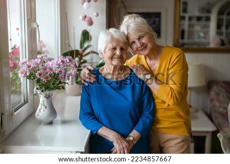 Woman hugging her elderly mother
 Royalty-Free Stock Photo #2234857667