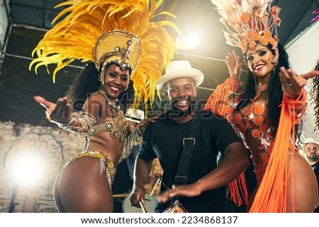 Carnival, brazil and band with woman dancers outdoor together for a new year celebration in rio de janeiro. Portrait, party and event with a man and female performance artists celebrating tradition Royalty-Free Stock Photo #2234868137