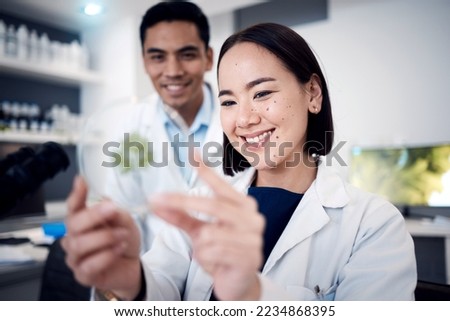 Scientist team, smile and green plant for food science study with doctors happy about growth development, analysis and research. Man and woman together in laboratory for medical or ecology innovation Royalty-Free Stock Photo #2234868395