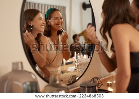 Mirror, beauty makeup and friends at party getting ready for new year celebration. Event, skincare cosmetics and happy women preparing for fun social gathering at night with lipstick at house party. Royalty-Free Stock Photo #2234868503