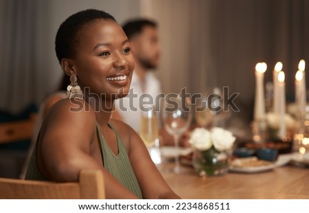 Dinner, party and thinking with a black woman at a table in celebration of the new year or a birthday. Event, idea and social with a young female sitting in a home or house for the festive season