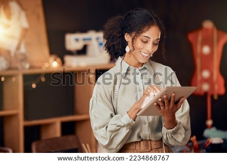 Black woman, fashion designer and tablet for planning, internet and web ideas in textile studio. Happy tailor, digital technology and manufacturing startup, small business owner and creative workshop Royalty-Free Stock Photo #2234868767