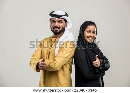 Portrait of arabic couple with traditional clothes in a studio