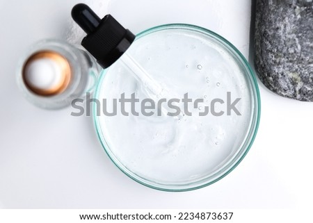 white liquid or raw material for skin care product, Serum products or natural chemical Royalty-Free Stock Photo #2234873637