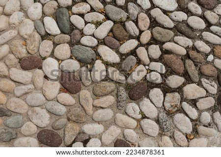 Neutral pattern of beige stones. Flat lay, top view