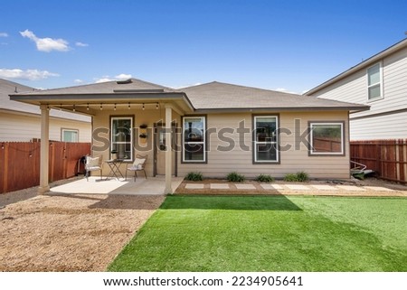 A home backyard with a yard 