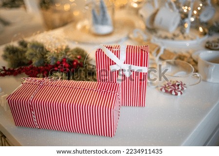 Red luxury New Year gift. Christmas gift. Happy New Year 2023. Christmas background with gift box. Christmastime celebration. . High quality photo