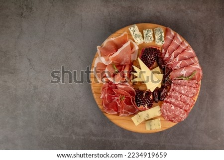 Appetizers table with different antipasti, charcuterie, snacks and cheese. Buffet party. Top view, copy space. Space for text or logo Royalty-Free Stock Photo #2234919659