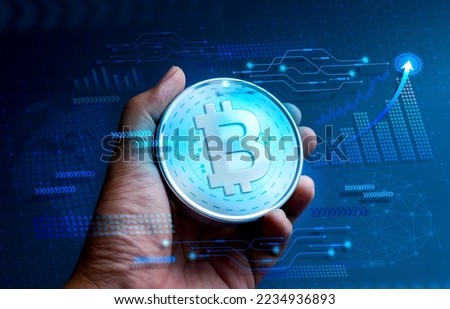 Bitcoin, digital assets in the hand with tech graphics, business growth graph, global icon on blue cyberspace, blockchain background, future financial, crypto currency, investment technology concepts. Royalty-Free Stock Photo #2234936893