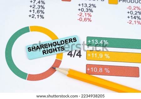 Business concept. On the business diagram is a pen and a sticker with the inscription - Shareholders rights