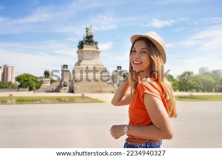 Portrait of smiling relaxed traveler woman walking in Sao Paulo city park, Brazil Royalty-Free Stock Photo #2234940327