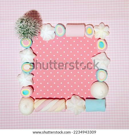 Candy pattern against pastel pink background, creative frame with copy space. 