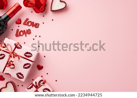 Valentine's Day concept. Top view photo of present boxes wine bottle heart shaped balloons candles confetti and inscriptions love on isolated pastel pink background with copyspace