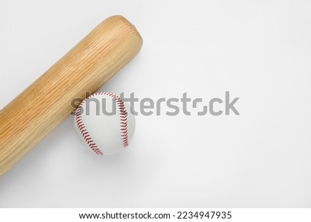 Wooden baseball bat and ball on white background, top view with space for text. Sports equipment