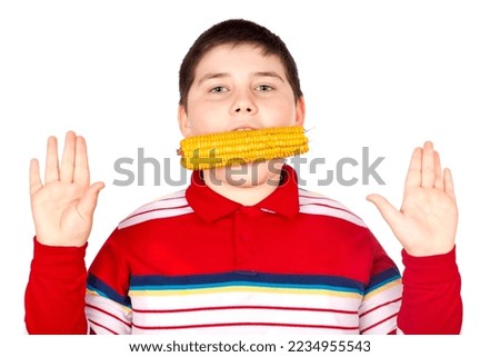 Boy eating fresh boiled corn isolated over white background
