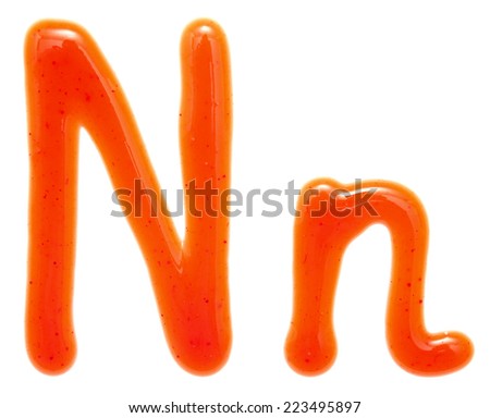 letters of ketchup isolated on white