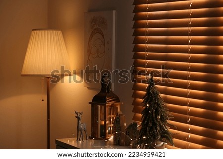 Beautiful Christmas picture in decorated room. Interior design