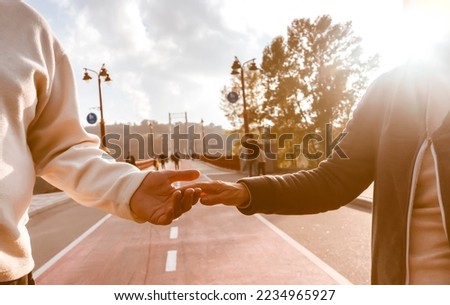 Couple, man and woman hold hands, with love and care