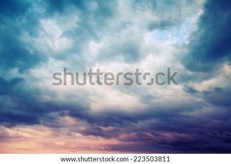 Dark blue stormy cloudy sky natural photo background with Instagram toned filter effect