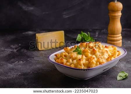 American mac and cheese, macaroni pasta in cheesy sauce. Royalty-Free Stock Photo #2235047023