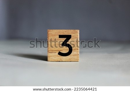 Number 3 on wooden blocks with white background.  Number 3 concept.  Royalty-Free Stock Photo #2235064421