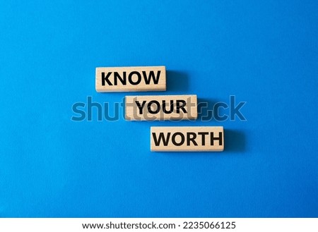 Know your worth symbol. Wooden blocks with words Know your worth. Beautiful blue background. Business and Know your worth concept. Copy space.