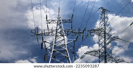 Electricity pylon (high voltage power line) on the background of the cloudy sky