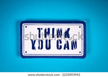 THINK YOU CAN. Sticky note with text on a blue background.