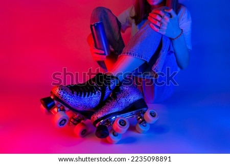 Roller skater holding a soda drink in a can during rest. Skating - sports and recreation. Saturated pink and blue, pop art style poster. Royalty-Free Stock Photo #2235098891