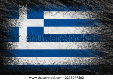 Flag of Greece. Flag is painted on black crumpled paper. Paper background. Textured creative background