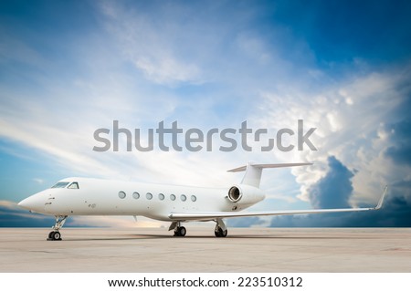jet plane parked with nice cloud  Royalty-Free Stock Photo #223510312
