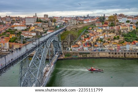  Old town skyline and Dom Luis bridge on the Douro River. Portugal.