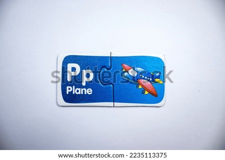 Airplane picture and airplane text puzzles placed together in the middle of a white background.