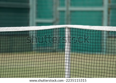 Tennis court net during a hard tennis match